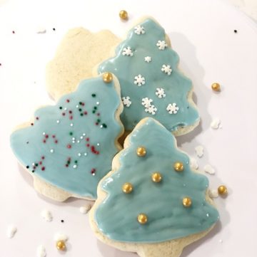 Decorated Christmas Tree Sugar Cookies on white plate