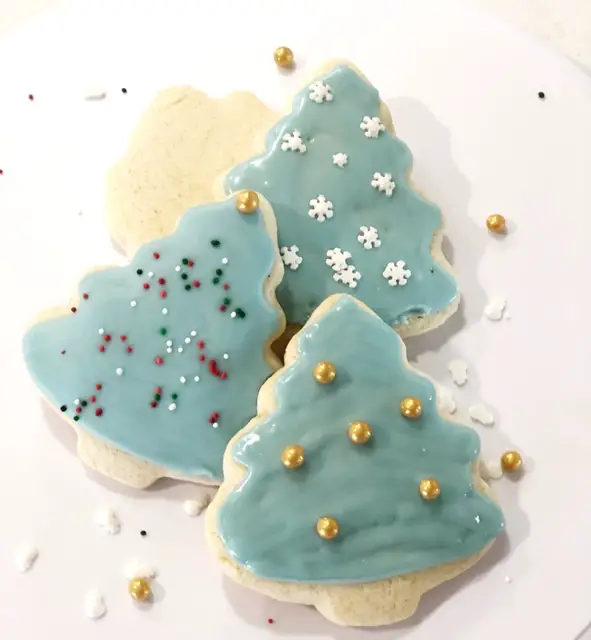 Decorated Christmas Tree Sugar Cookies on white plate