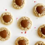 Heart gluten free peanut butter blossoms on white table