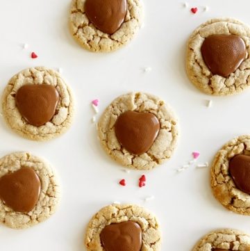 Heart gluten free peanut butter blossoms on white table