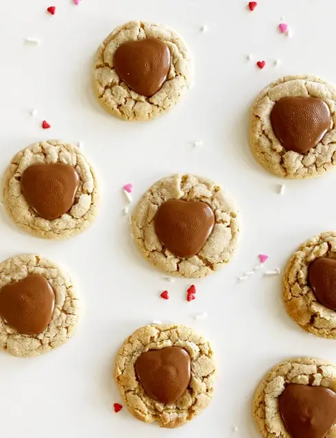 Heart gluten free peanut butter blossoms on white table