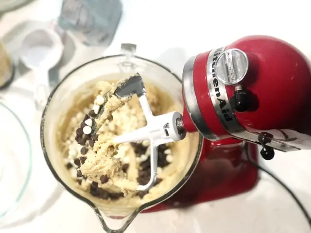 red mixer with gluten-free chocolate chip cookie dough