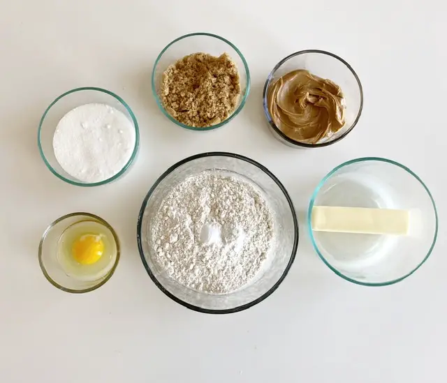 Ingredient's for gluten free peanut butter cookies in glass mixing bowls