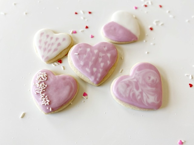 5 gluten free heart shaped sugar cookies with royal icing