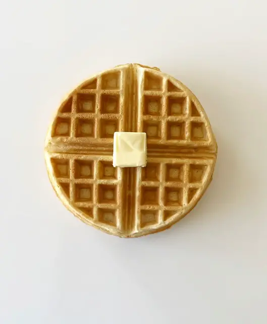 close up of gluten free waffle topped with butter