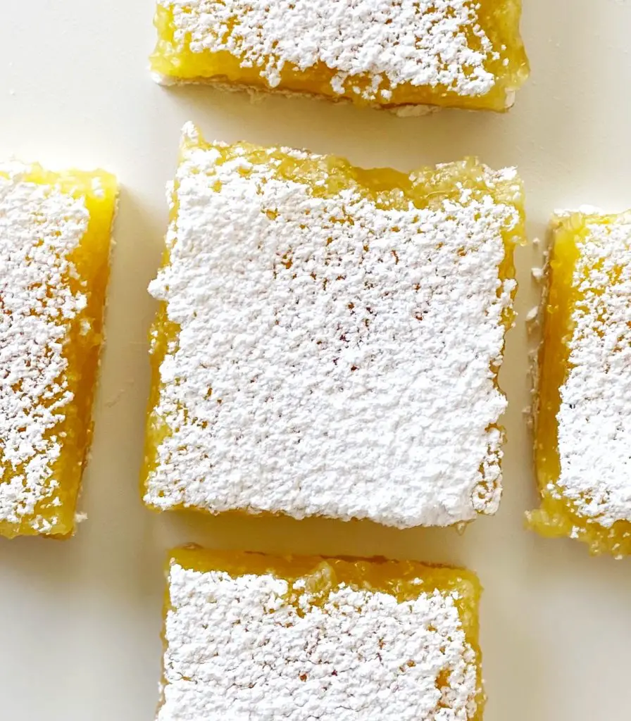 5 lemon bars on white table