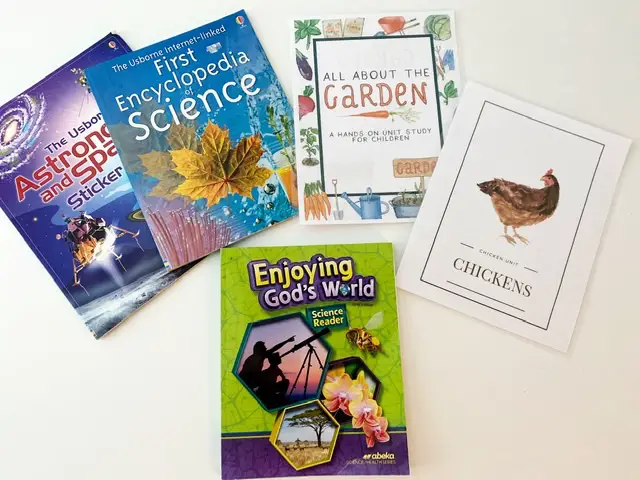 Abeka Science curriculum, usborne astronomy, first encyclopedia of science, all about the garden, chicken unit all on white table 