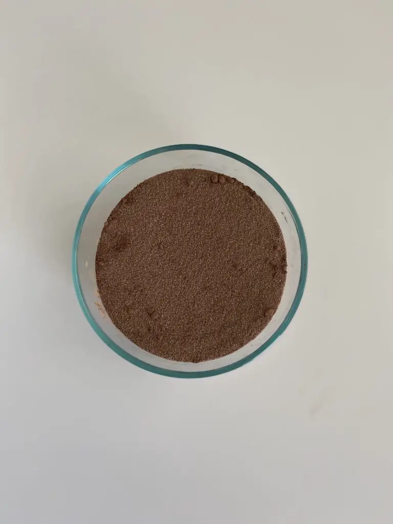 cocoa and sugar in glass mixing bowl 