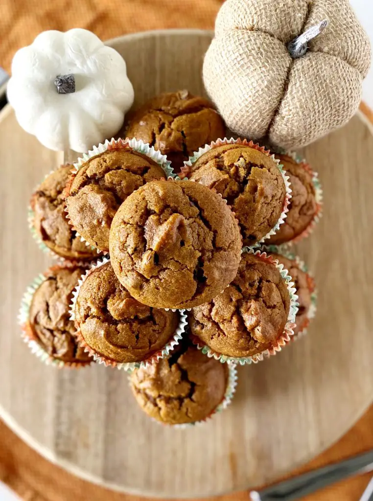 gluten free chocolate chip pumpkin muffins on wooden cutting board