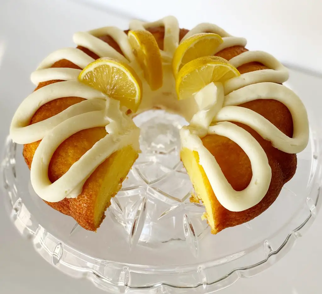 gluten free lemon bundt cake on glass cake stand