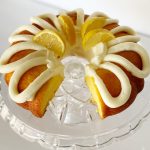 gluten free lemon bundt cake on glass cake stand