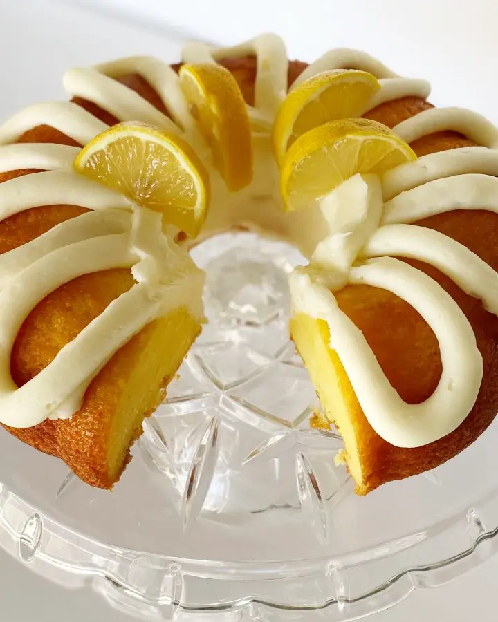 gluten free lemon bundt cake on glass cake stand