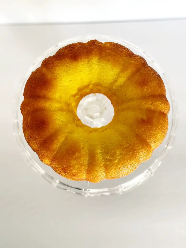 gluten free lemon bundt cake on glass cake stand 
